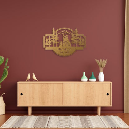 Personalized Bear Family Metal Sign – Custom Cabin & Family Name Wall Art in gold against a red wall hanging above a contemporary credenza.
