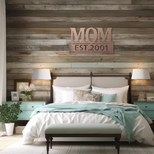 Personalized MOM metal wall sign with custom established date displayed above a bed in a rustic bedroom